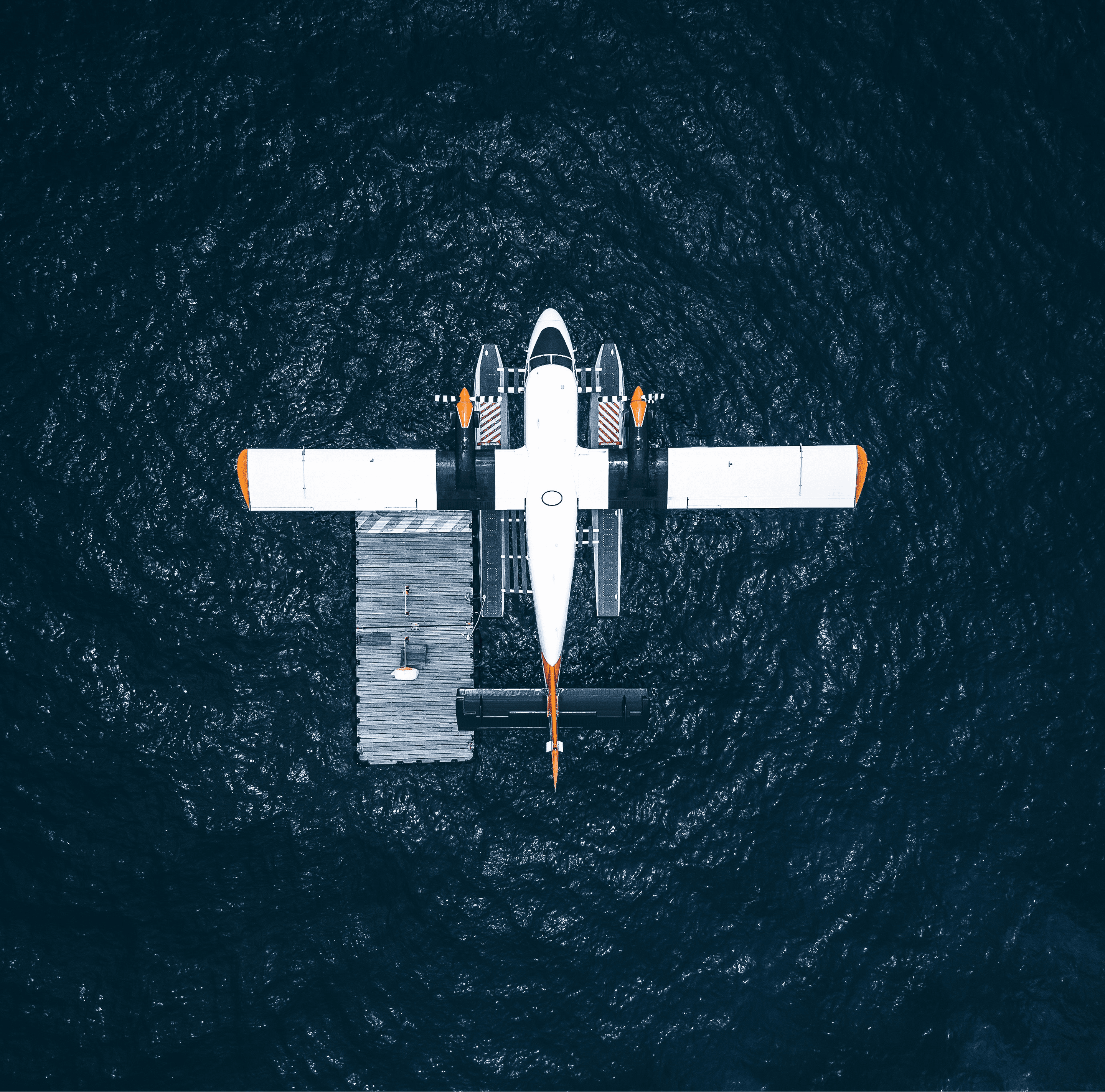Aerial view of a seaplane on dark water